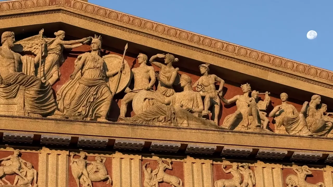 The sculpted pediment of the Parthenon with the Moon above it, from the film